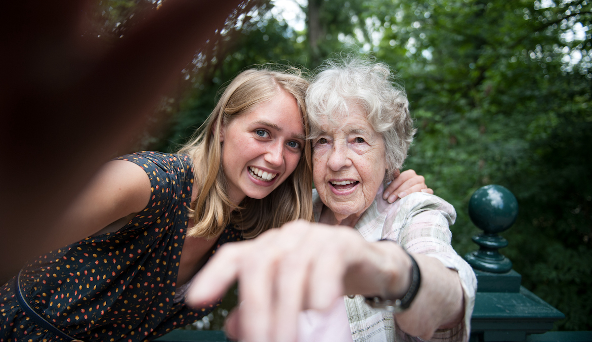 Senior lady and young woman making a selfie