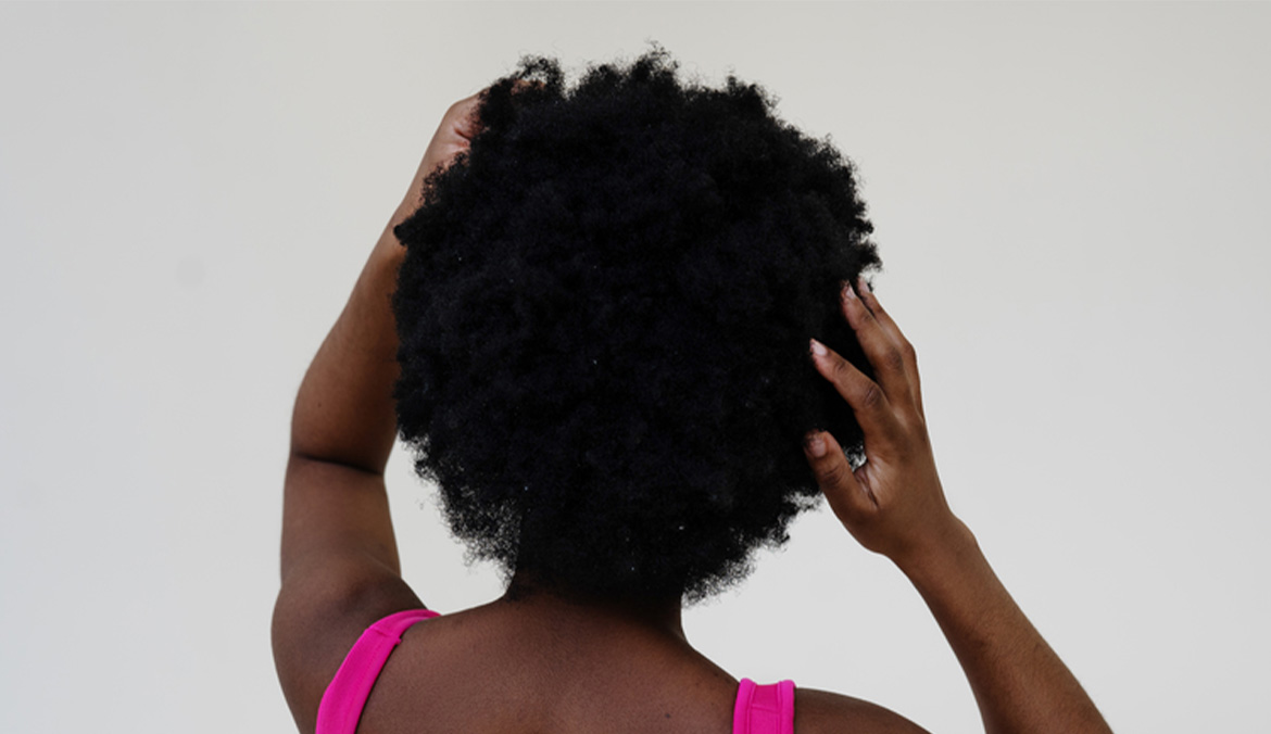 A Black woman with type 4 textured hair