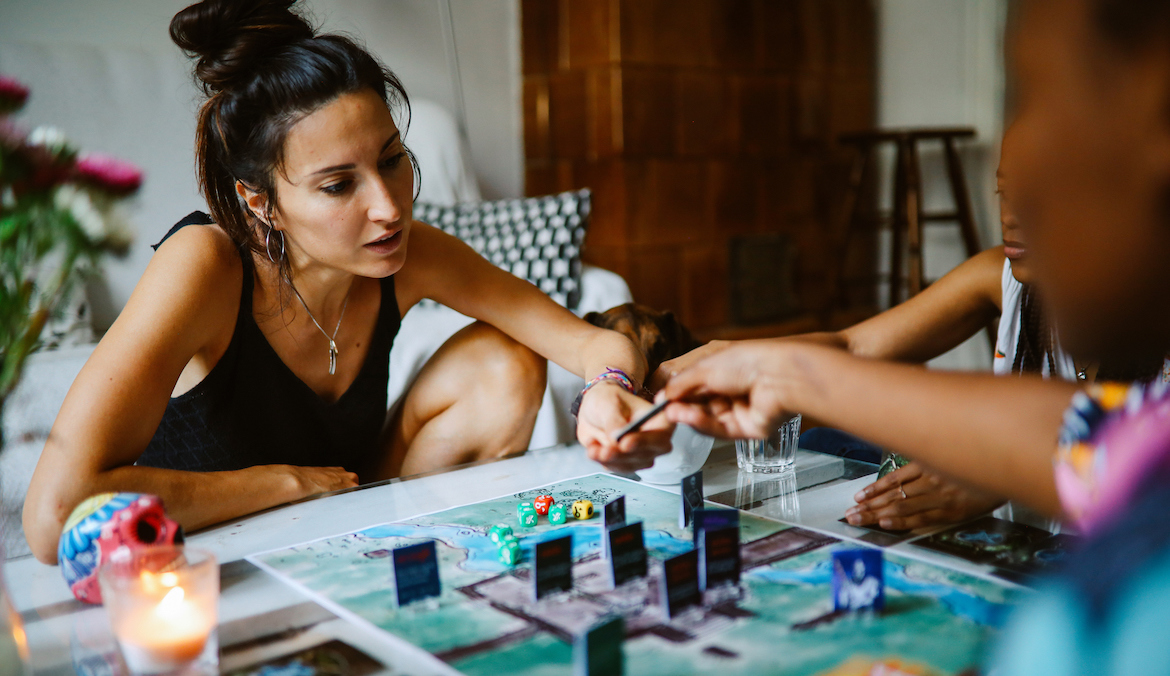 friends playing tabletop board game