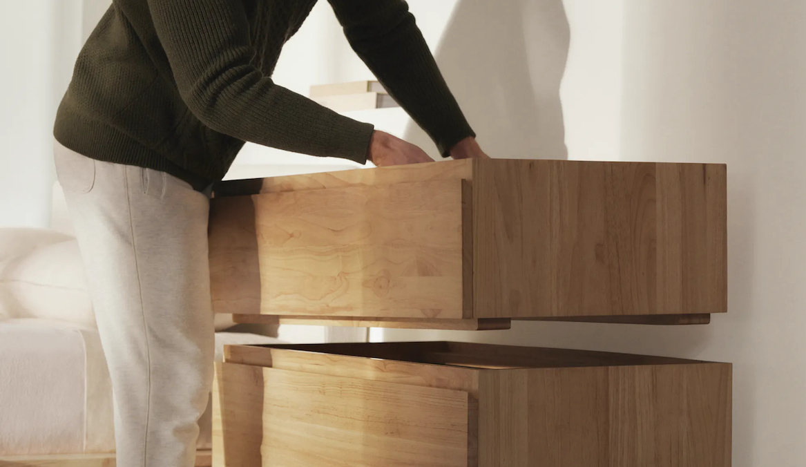 person putting together a thuma dresser