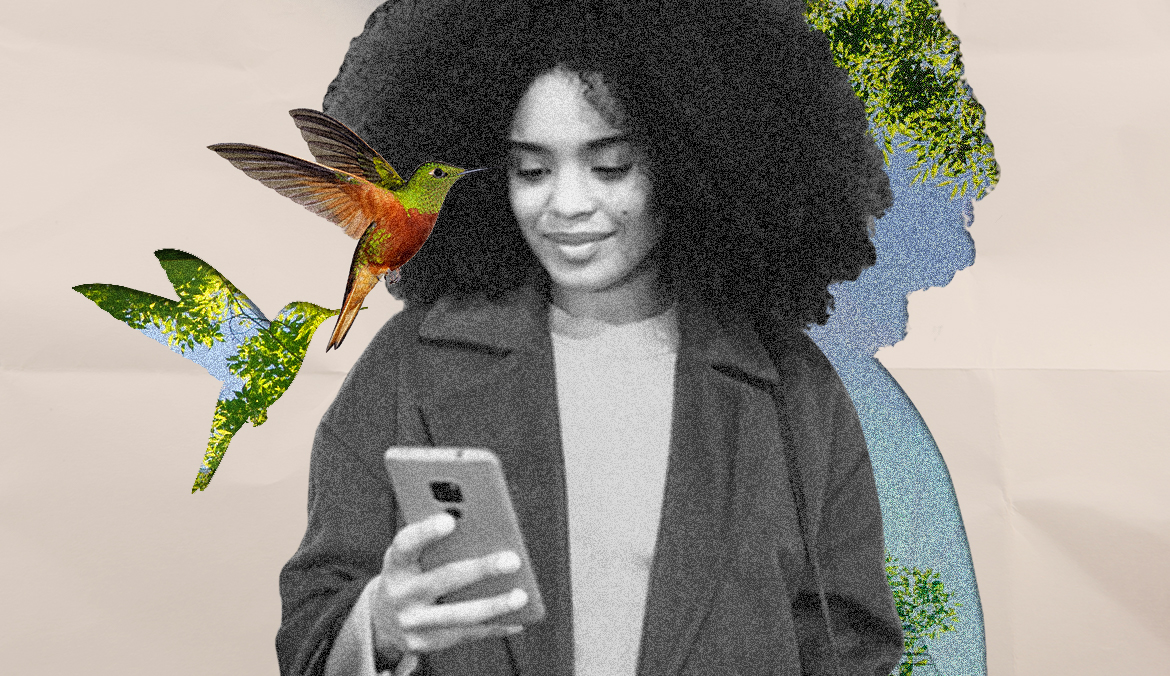 woman looks at phone with birds around her