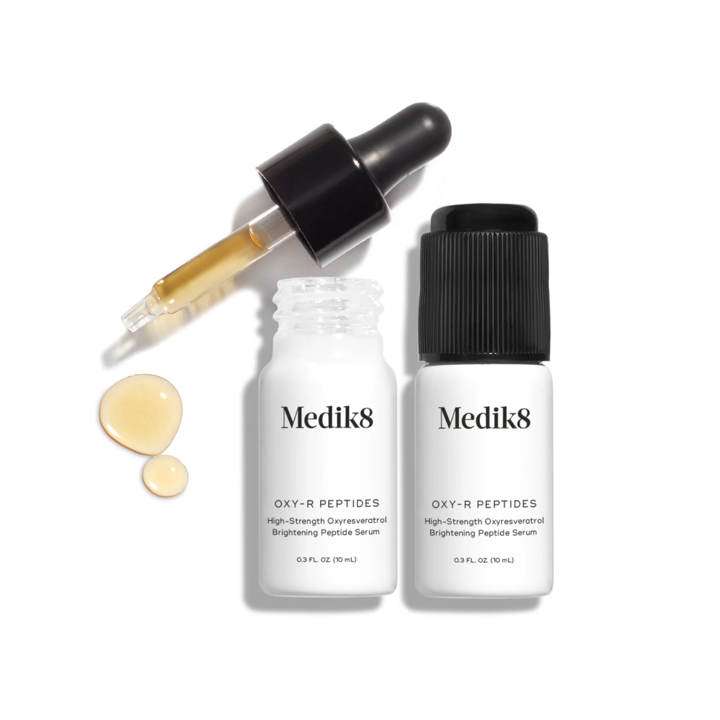 two bottles of medik8 oxy-r peptides serum with a dropper