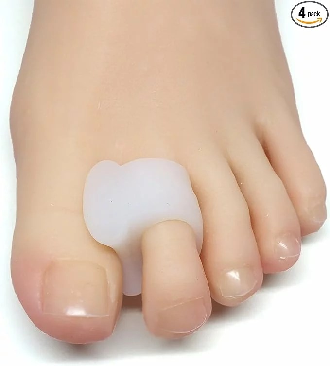 A foot with a toe spacer worn in between the big toe and index toe.