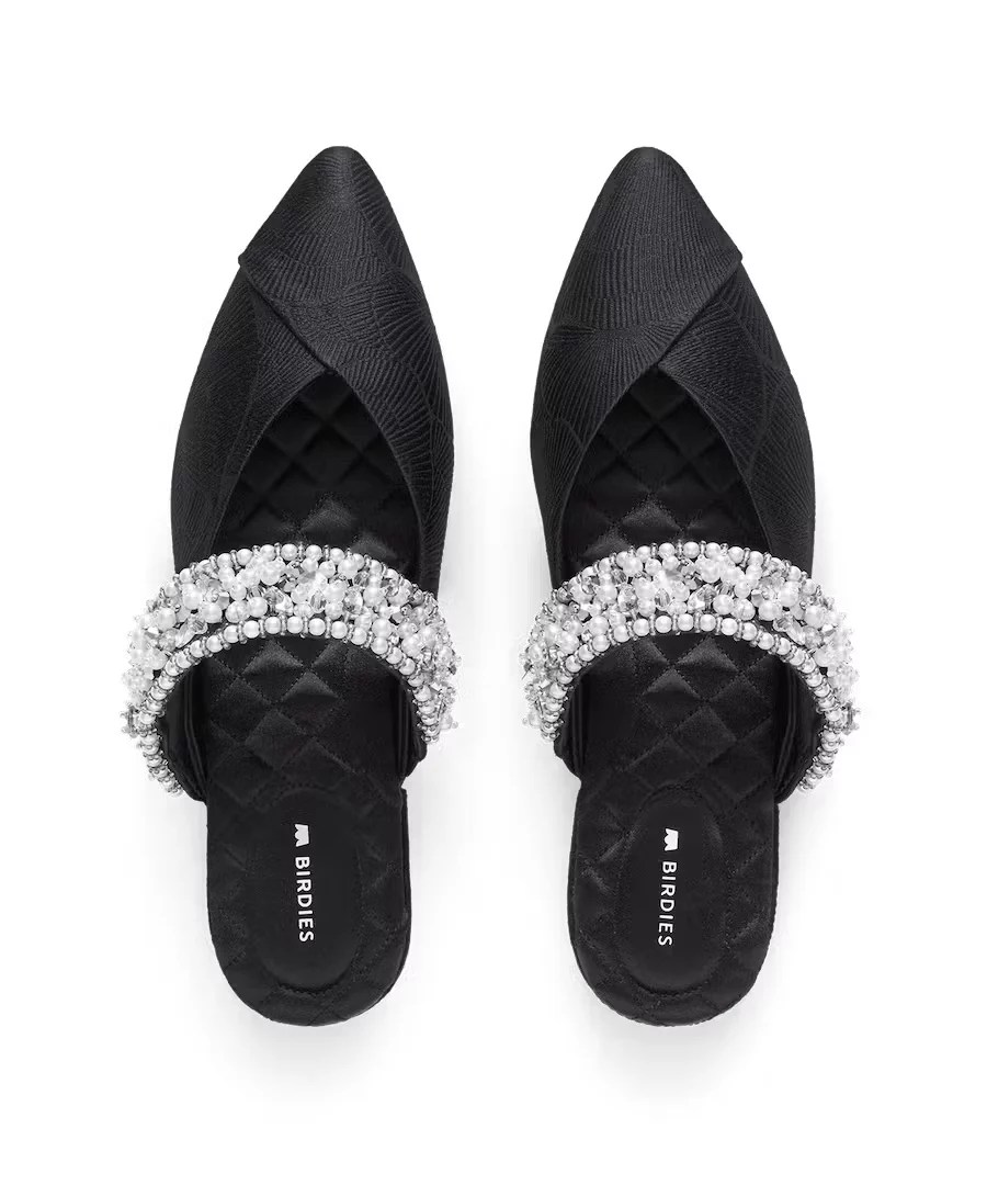 black birdies shoes with a pearl beaded cuff