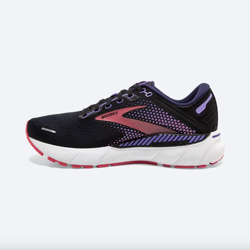 A black running shoe with a pink stripe