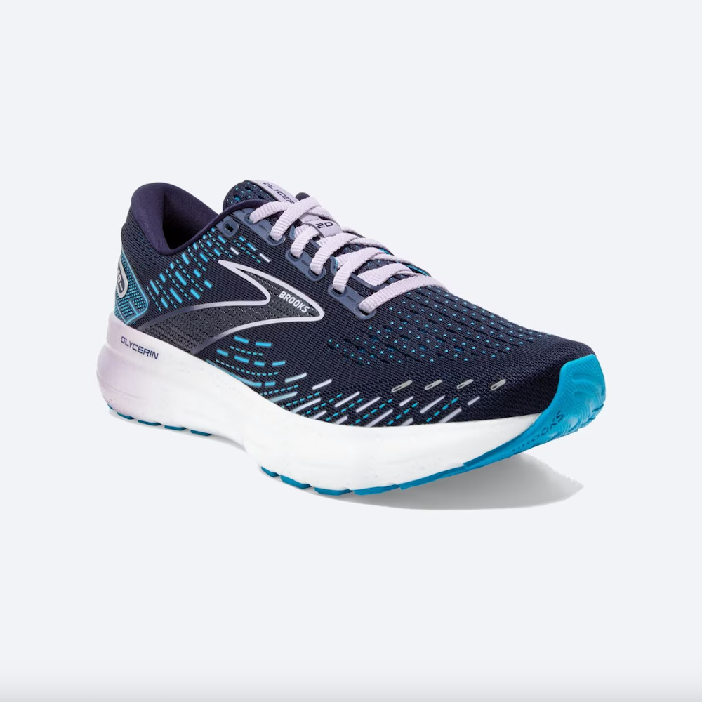 A navy running shoe with pink and teal accents