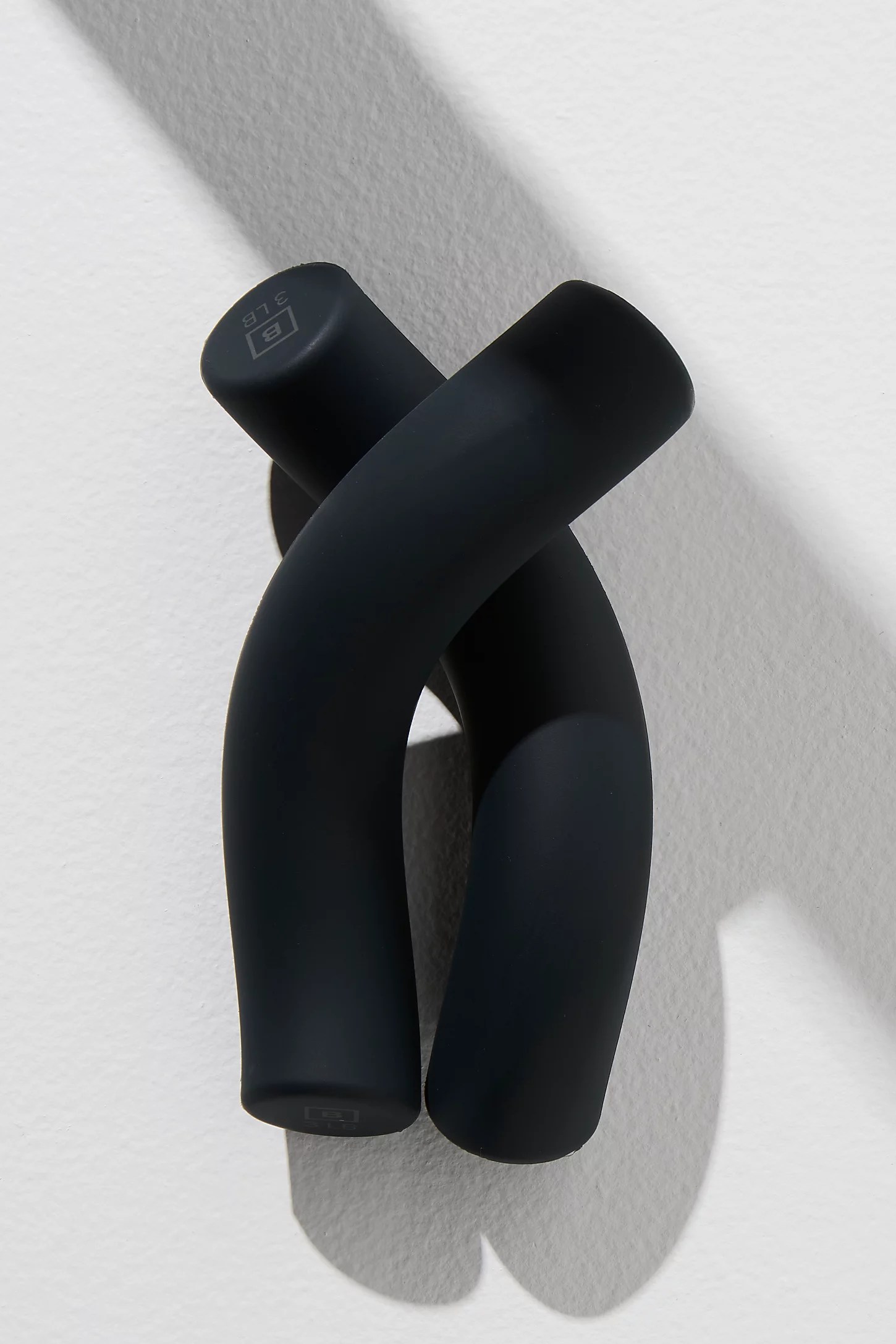 a set of two black b yoga helix weights, at-home pilates equipment