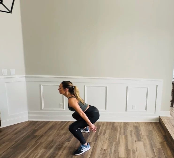 Physical therapist demonstrating jump squat