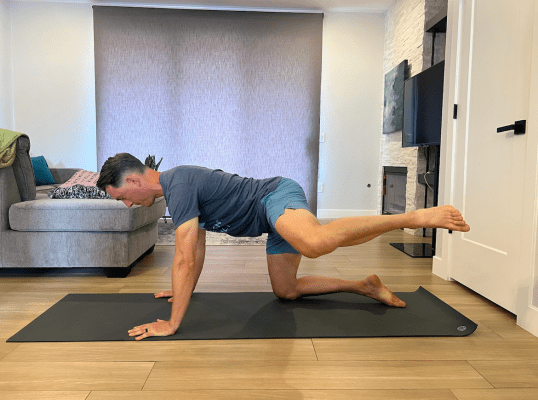 Physical therapist demonstrating full-range-of-motion hip activation