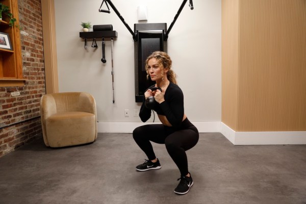 Personal trainer demonstrating goblet squat
