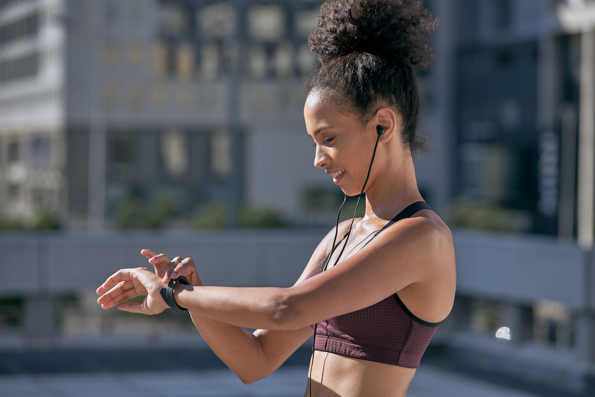 Close-up of person using fitness watch as an example of best morning workout products