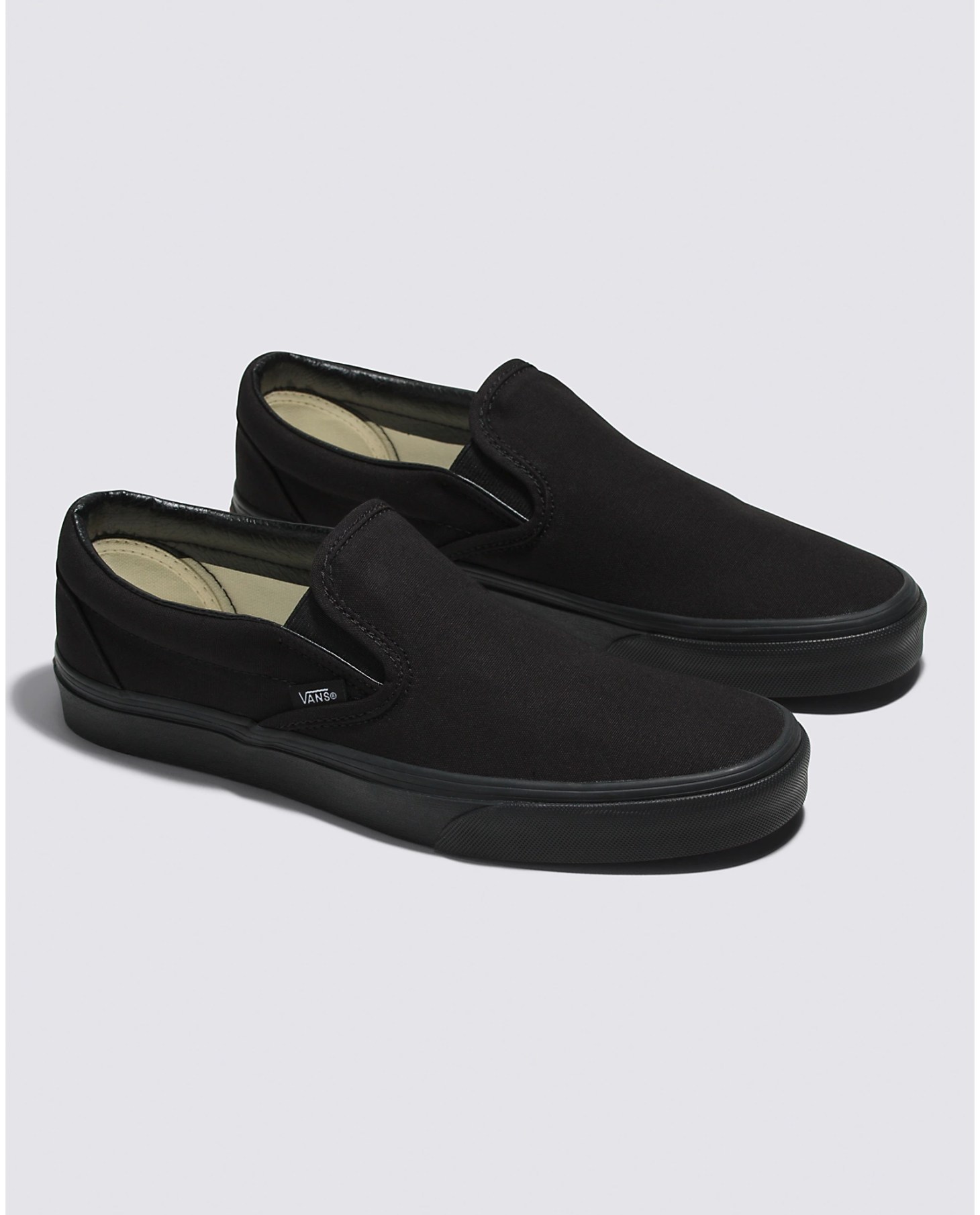 vans classic slip ons, one of the best black sneakers for women