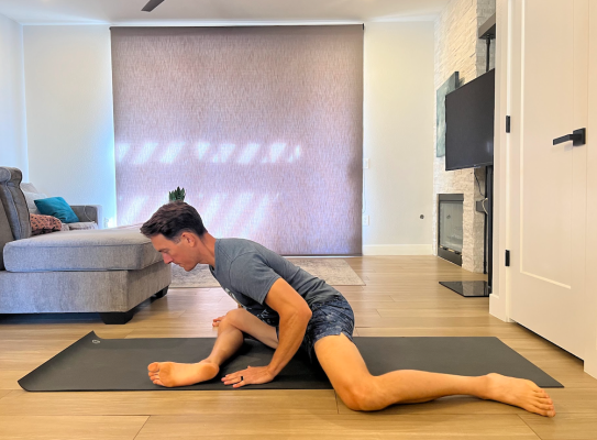 Physical therapist demonstrating active 90-90 stretch