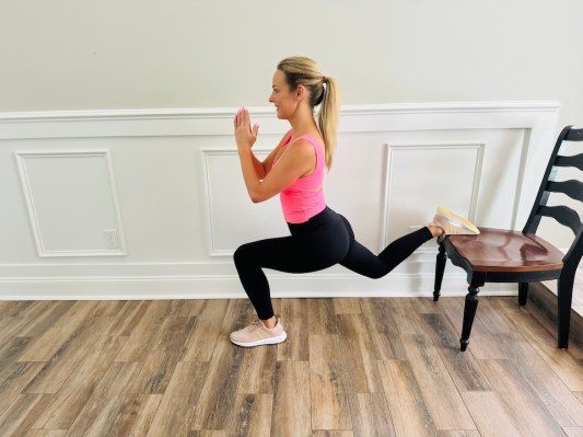 Physical therapist demonstrating split squat