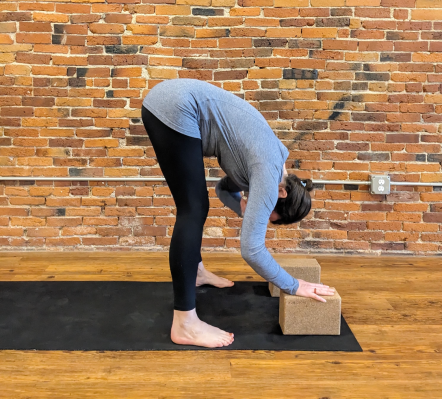 Pregnant person doing a modified forward fold