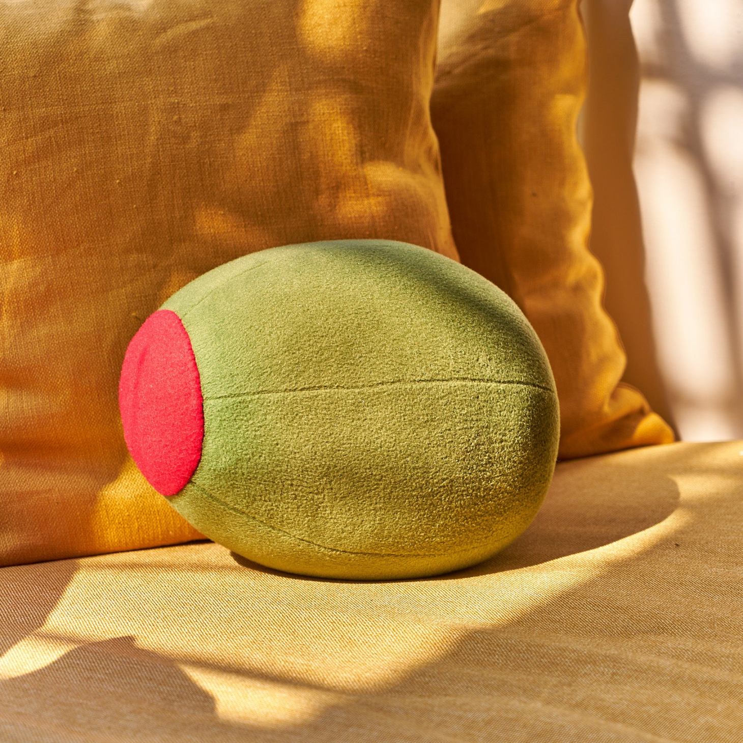 olive pillow from big night, from our mother's day gift guide